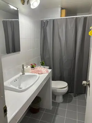 a bathroom with a sink and a toilet and a shower at Ally home 14 06 in Thung Si Kan
