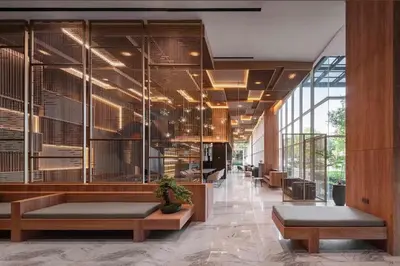a lobby with a large wall of glass at Urban Oasis BTS Ekkamai in Khlong Toei