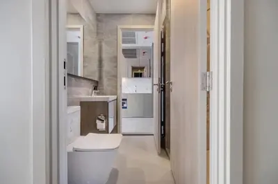 a bathroom with a sink and a toilet at New City Condo in Central Bangkok in Pratunam
