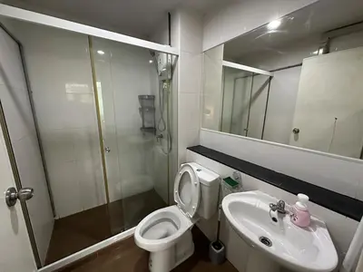 a bathroom with a toilet and a sink and a shower at Cozy Room - On Nut - Wi-Fi, Gym, Pool in Bangkok