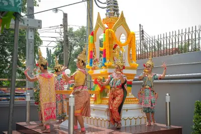 a group of women standing in front of a temple at B32 Apartment in Bangna