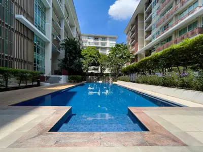 a swimming pool in the middle of a building at Near BTS l Fully Furnished l Pool and Gym in Bangkok