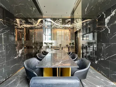a conference room with a table and chairs at Near BTS l Central Sukhumvit l Pool and Sauna in Bangkok