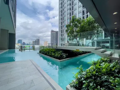 a swimming pool in the middle of a building at 600 m to BTS l City View l Rooftop Pool in Bangkok