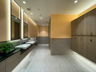 a bathroom with two sinks and two mirrors at 600 m to BTS l City View l Rooftop Pool in Bangkok