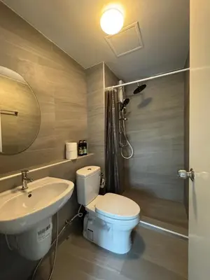 a bathroom with a toilet and a sink at Minimal Condo At Ramkhamhaeng 64 in Sathani Ban Hua Mak