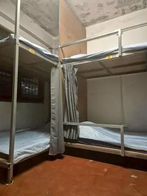 a couple of bunk beds in a room at Bangkhunnon Station Hostel in Sathani Thon Buri