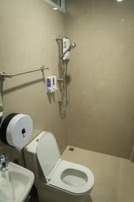 a bathroom with a toilet and a sink at Greet Hostel & Cafe Samyan in Bangkok