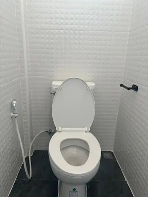 a small bathroom with a toilet in a stall at Siam Place - In the Heart of Bangkok in Bangkok