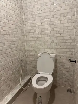 a bathroom with a toilet with a hose at Siam Place - In the Heart of Bangkok in Bangkok