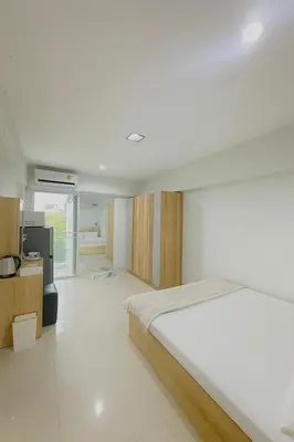 a bedroom with a bed and a television in it at City View Condo 5 mins to MRT Sutthisarn in Bangkok
