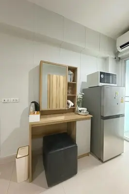 a kitchen with a desk with a mirror and a refrigerator at City View Condo 5 mins to MRT Sutthisarn in Bangkok