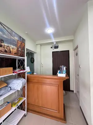 a room with a desk in a room at City View Condo 5 mins to MRT Sutthisarn in Bangkok