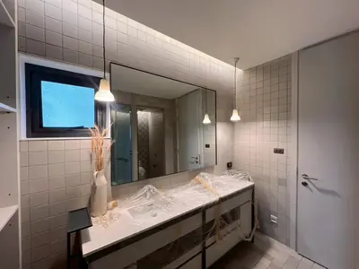 a bathroom with two sinks and a mirror at Tree Villa Bangkok in Bangkok