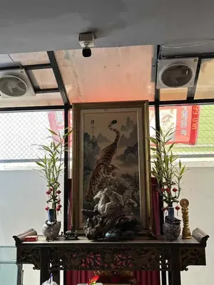 a framed picture on a table with two vases at 101Hotel in Bangkok