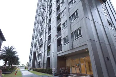 a tall gray building with a lot of windows at Manor Riverfront Stay, Chaophraya View Condo, Nonthaburi in Ban Tha It (1)