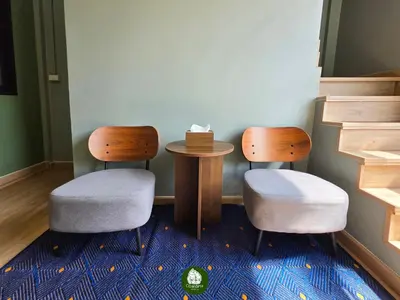 two chairs and a table in a room at Obahomu Vacation House for 4-8 pax, 5 min walk to Icon Siam in Bangkok