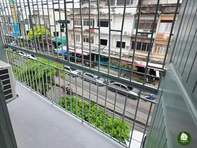 a balcony with a view of a street with cars at Obahomu Vacation House for 4-8 pax, 5 min walk to Icon Siam in Bangkok