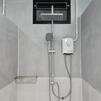 a shower with a blow dryer in a bathroom at Obahomu Vacation House for 4-8 pax, 5 min walk to Icon Siam in Bangkok