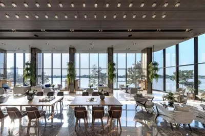 a large room with tables and chairs and windows at The Politan Aqua, River Front in Ban Sai Ma