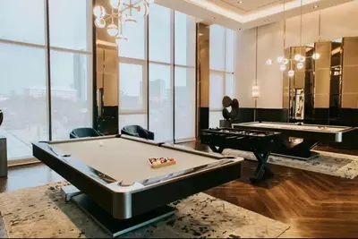a billiard room with two pool tables and a piano at The Politan Aqua, River Front in Ban Sai Ma