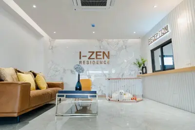 a living room with a couch and a table at I-Zen Residence Central Eastville in Bangkok