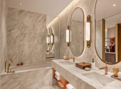 a bathroom with two sinks and a large mirror at Andaz One Bangkok in Bangkok