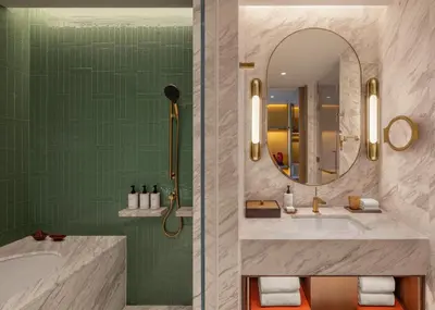 a bathroom with a tub and a sink and a mirror at Andaz One Bangkok in Bangkok