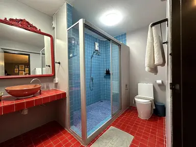 a bathroom with a shower and a sink and a toilet at Delightful Townhouse in the Heart of Sukhumvit in Bangkok