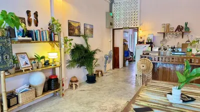 a room filled with lots of potted plants at Baan YentaFo - Pink House in Talad Noi in Chinatown