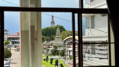 a view of a city from a window at Baan PadSeeEw - Rooftop Riverview in Khlong San