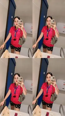 a woman taking a picture of herself in a bathroom mirror at Noey sun in Sathani Sam Sen
