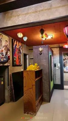a room with a counter with paintings on the wall at โรงแรม เลิฟ บีเคเค in Amphoe Phra Khanong