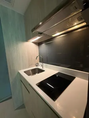 a kitchen with a sink and a counter top at Cozy room in Sukumvit in Bangkok