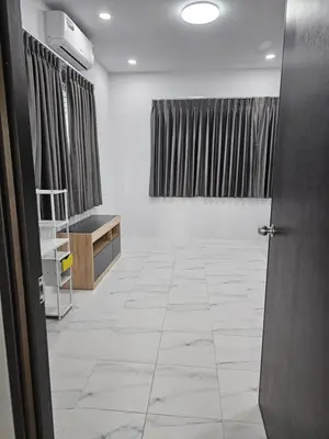 a room with a hallway with a tile floor at Cozy Corner in Samut Prakan
