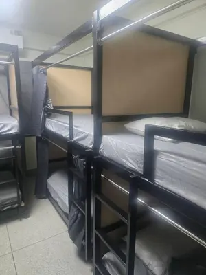 a room with two bunk beds in a room at Cozy bangkok hostel in Bangkok