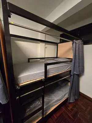 a couple of bunk beds in a room at Cozy bangkok hostel in Bangkok