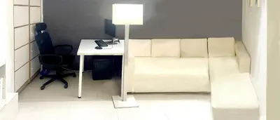 a room with a bed and a desk with a lamp at AkkHouse in Ban Bang Toei (1)