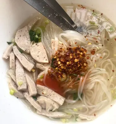 a bowl of soup with noodles and other foods at AkkHouse in Ban Bang Toei (1)