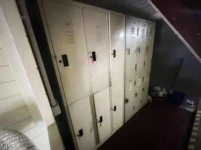 a row of lockers in a locker room at Happy Hope Khao San in Bangkok