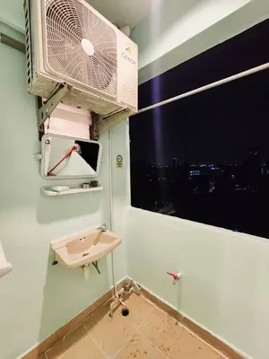 a bathroom with a sink and a window at 704-STP Homely room Free Wi-Fi and Near BTS in Bangkok