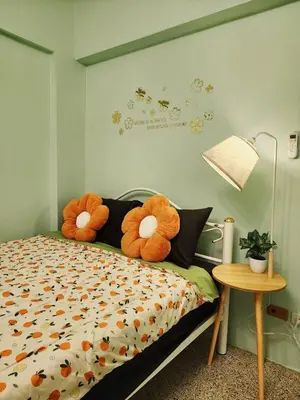two stuffed animals sitting on a bed in a bedroom at 704-STP Homely room Free Wi-Fi and Near BTS in Bangkok