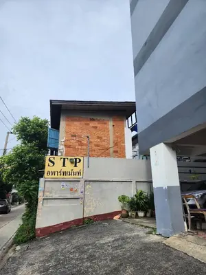 a building with a sign on the side of it at 704-STP Homely room Free Wi-Fi and Near BTS in Bangkok