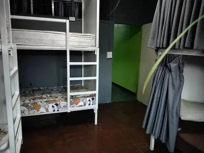 a small room with a bunk bed and a bunk bed at A fantastic house next to W district food market in Amphoe Phra Khanong