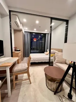 a living room with a bed and a couch at In Unit Workspace Gym and Infinity Pool MRT 200m in Bangkok