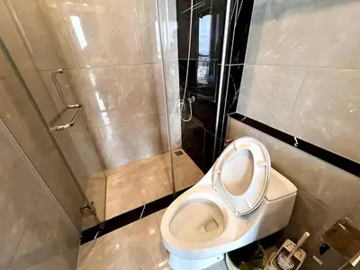 a bathroom with a toilet and a shower at High Floor Apt with Large Living Room Pool and Gym in Ban Na Song