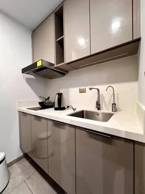 a kitchen with a sink and a counter top at 40th Fl Skyview with Standing Desk Pool and Gym in Ban Na Song