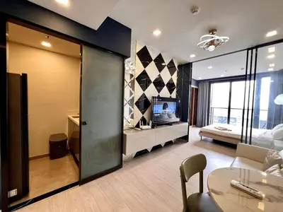 a large living room with a couch and a bed at 53Fl Skyview with King Bed Pool and Gym MRT200m in Ban Na Song