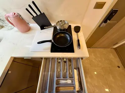 a pot sitting on top of a kitchen counter at Peak Luxury Living with King Bed Golf Pool and Gym in Ban Na Song