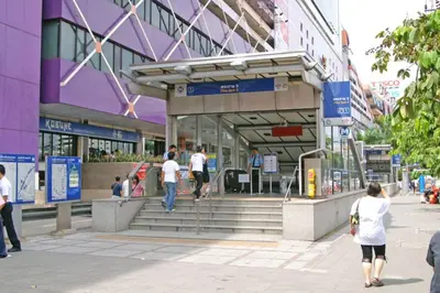 a group of people walking in front of a building at Free Parking with Balcony Pool and Gym MRT 200m in Ban Na Song